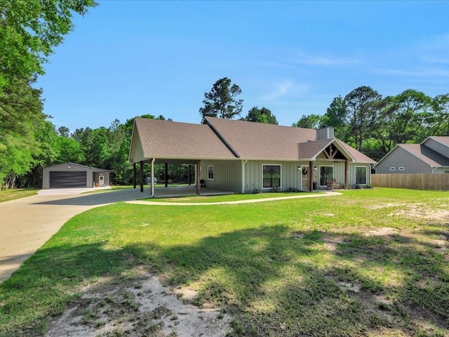 single story home with a detached garage, a front lawn, board and batten siding, an outdoor structure, and fence