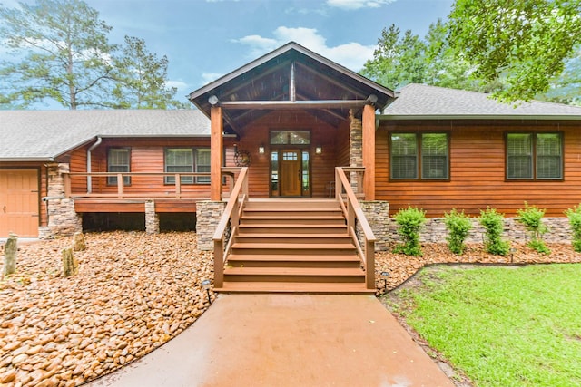 view of front of house featuring a porch and a shingled roof