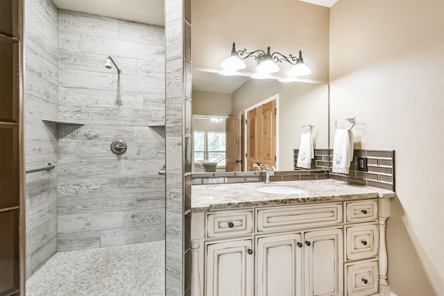 bathroom with a walk in shower and vanity