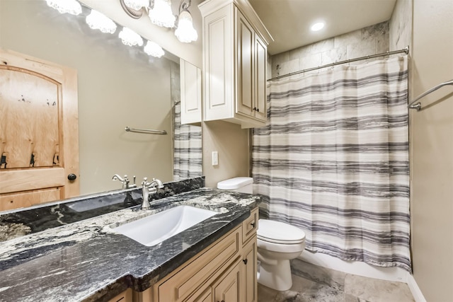 full bathroom with vanity, toilet, and curtained shower