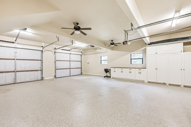 garage with baseboards and a garage door opener