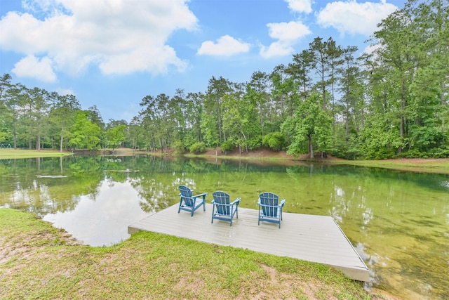 dock area featuring a view of trees and a water view