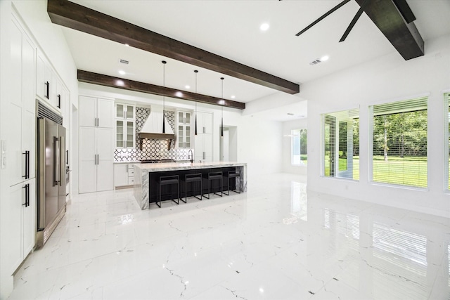 671 Rd 6609, Dayton, TX 77535 - kitchen featuring appliances with stainless steel finishes, custom exhaust hood, beamed ceiling, decorative backsplash, and a ceiling fan