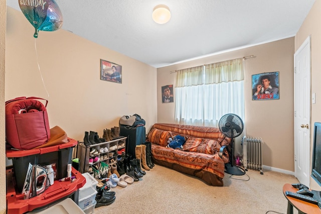 living room featuring carpet flooring and radiator heating unit