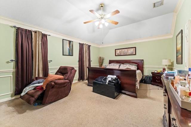 bedroom with carpet flooring, wainscoting, visible vents, and ornamental molding