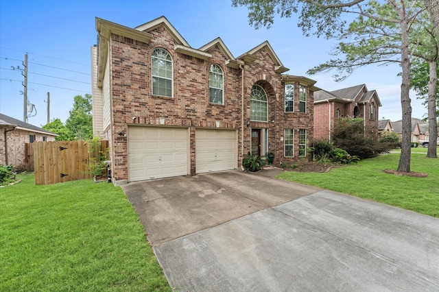 traditional-style home featuring fence, a front lawn, brick siding, a garage, and driveway