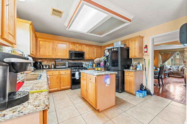 kitchen featuring visible vents, smart refrigerator, gas stove, stainless steel microwave, and light tile patterned flooring