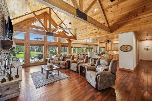 living area featuring wooden ceiling, a ceiling fan, and beam ceiling