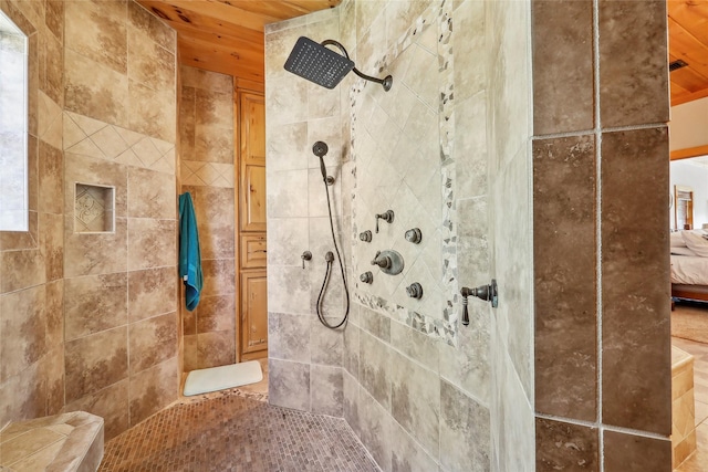full bathroom with ensuite bath and tiled shower