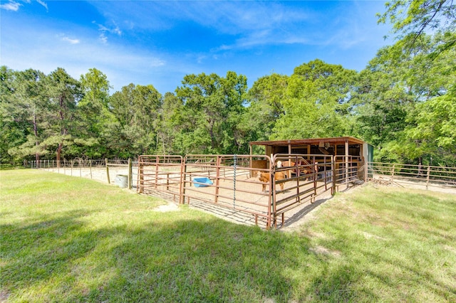 view of stable with a forest view