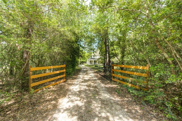 view of gate featuring fence