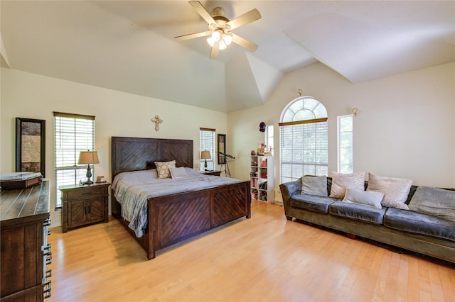 bedroom with vaulted ceiling, light wood-type flooring, and ceiling fan