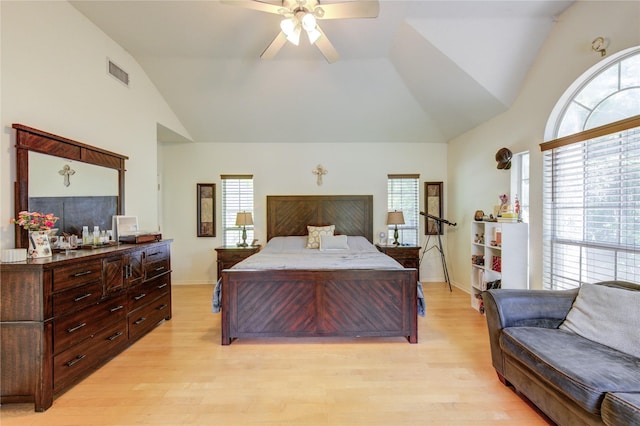bedroom featuring multiple windows, light wood-style floors, and visible vents
