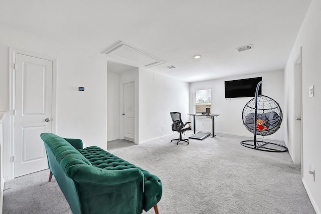 living area featuring attic access, baseboards, visible vents, and carpet