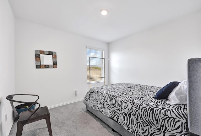 carpeted bedroom with baseboards