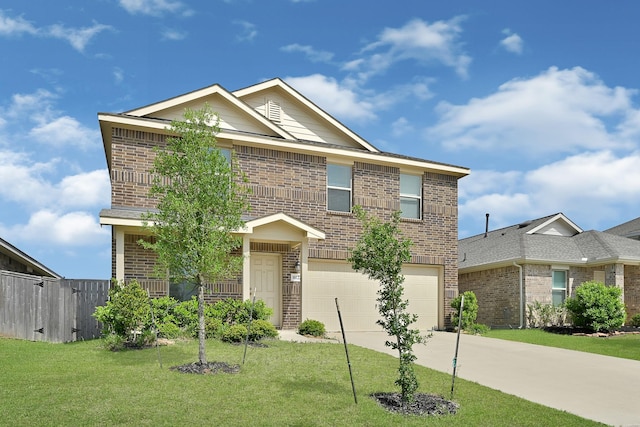 view of front of home with concrete driveway, a front lawn, an attached garage, fence, and brick siding