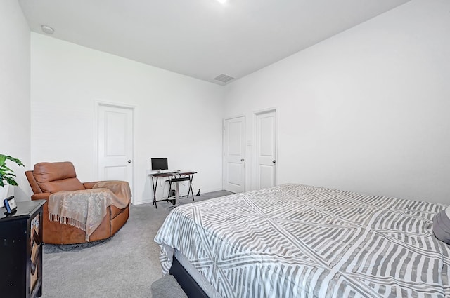 carpeted bedroom with visible vents