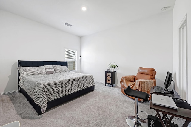 carpeted bedroom with baseboards and visible vents