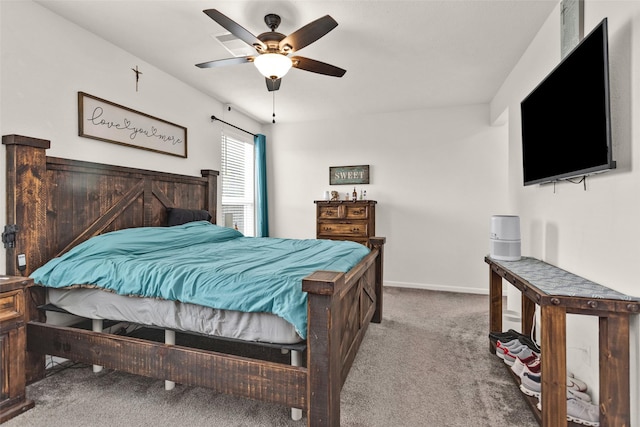 bedroom with carpet, a ceiling fan, and baseboards