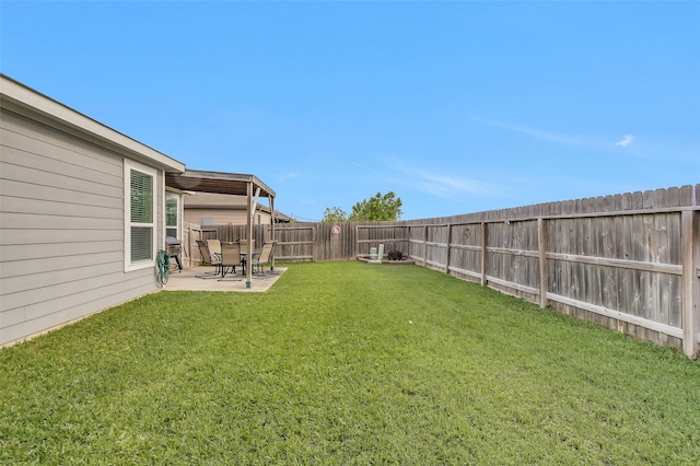 view of yard featuring a fenced backyard and a patio