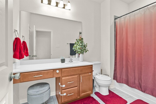 full bath with shower / tub combo with curtain, tile patterned flooring, vanity, and toilet