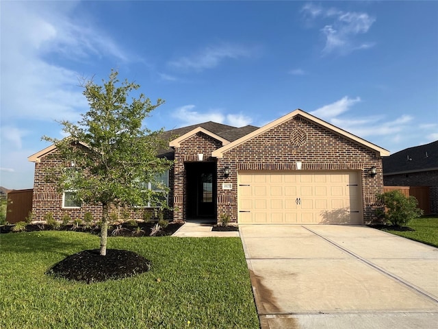 ranch-style home featuring brick siding, a front lawn, an attached garage, and concrete driveway