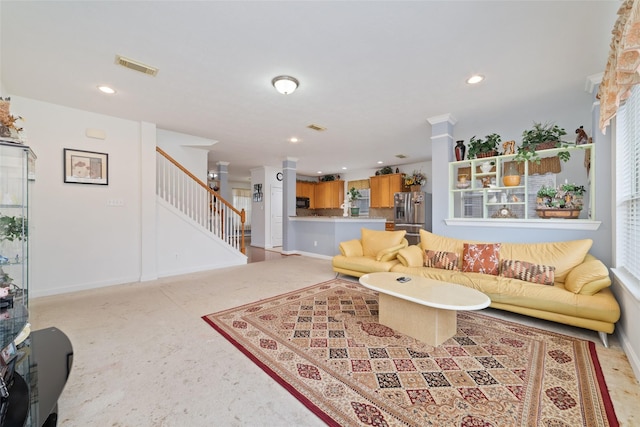 living room with plenty of natural light, visible vents, recessed lighting, and stairway