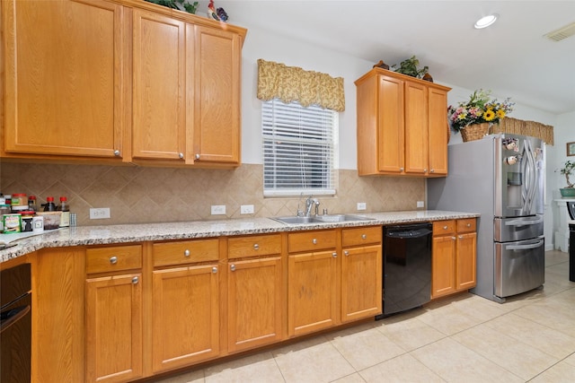 kitchen with a sink, oven, light tile patterned floors, stainless steel fridge with ice dispenser, and black dishwasher