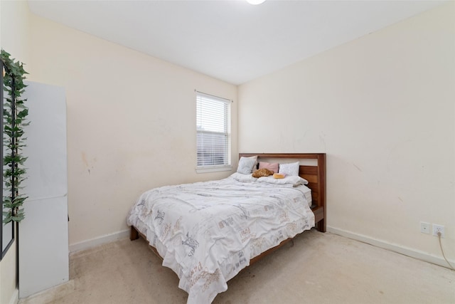 carpeted bedroom with baseboards