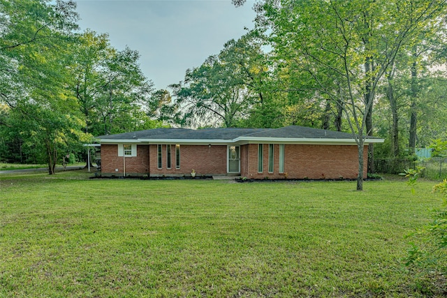 120 Sugar Ln, Lufkin, TX 75904 - ranch-style house featuring fence, a front lawn, and brick siding