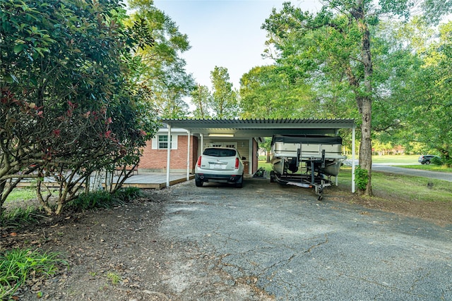 120 Sugar Ln, Lufkin, TX 75904 - view of car parking featuring a carport and aphalt driveway