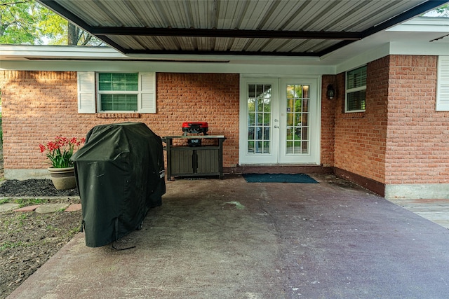 120 Sugar Ln, Lufkin, TX 75904 - property entrance featuring brick siding, french doors, and a patio area