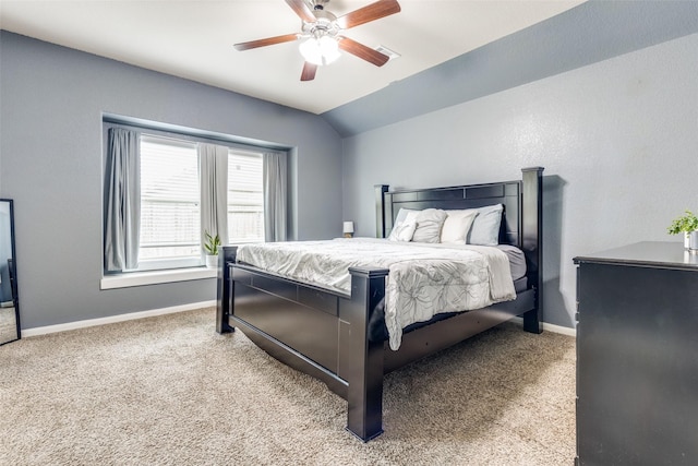 bedroom with lofted ceiling, baseboards, a ceiling fan, and carpet flooring