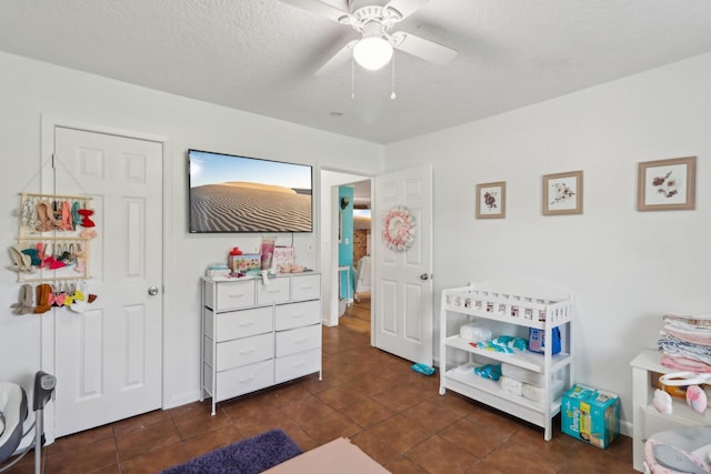 9 Slover Dr, Dayton, TX 77535 - bedroom featuring dark tile patterned floors and ceiling fan