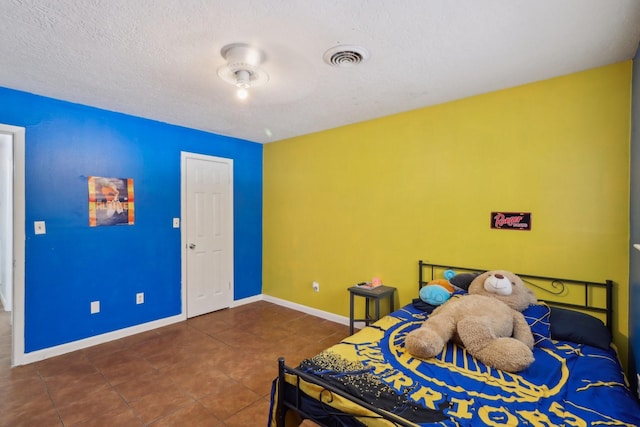 9 Slover Dr, Dayton, TX 77535 - tiled bedroom featuring baseboards and visible vents