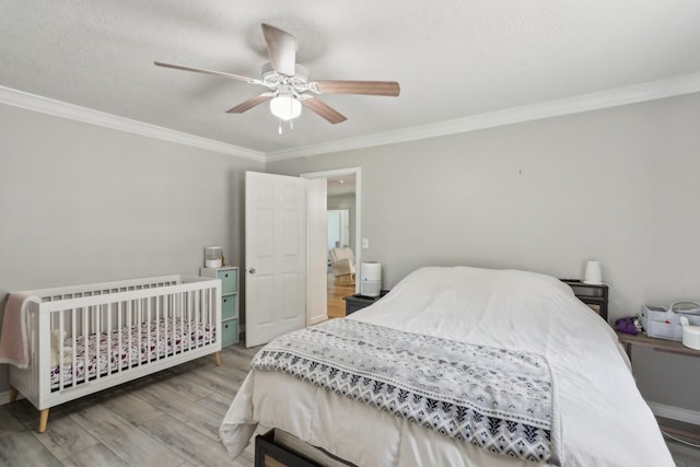 9 Slover Dr, Dayton, TX 77535 - bedroom featuring wood finished floors, crown molding, and a ceiling fan