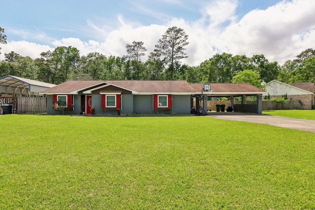 9 Slover Dr, Dayton, TX 77535 - ranch-style house with concrete driveway, fence, a detached carport, and a front yard