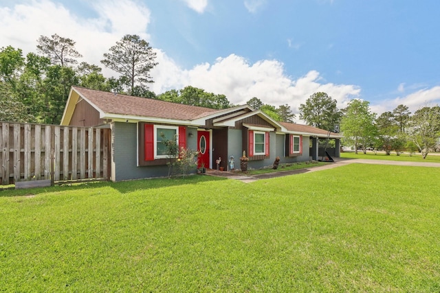 9 Slover Dr, Dayton, TX 77535 - single story home featuring fence, driveway, and a front yard