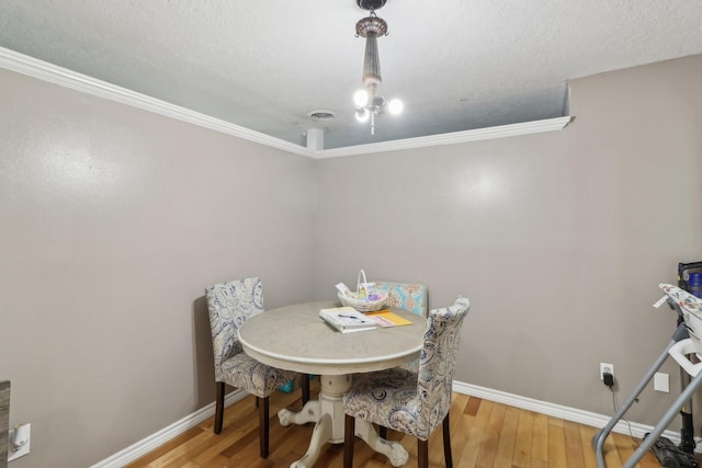9 Slover Dr, Dayton, TX 77535 - dining space with baseboards, ornamental molding, wood finished floors, and visible vents
