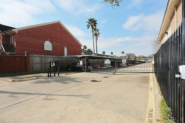 2250 Bering Dr Unit 98, Houston, TX 77057 - view of vehicle parking with a gate, fence, and concrete driveway