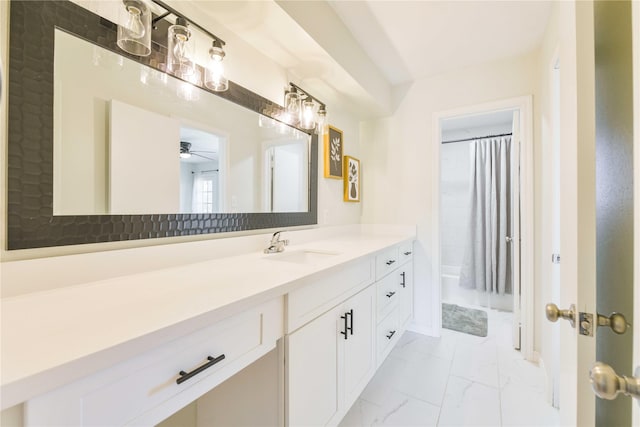 bathroom featuring marble finish floor, a shower with curtain, vanity, and ceiling fan