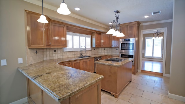 26 Royal Dalton Cir, Conroe, TX 77304 - kitchen with visible vents, brown cabinetry, baseboards, a sink, and stainless steel appliances