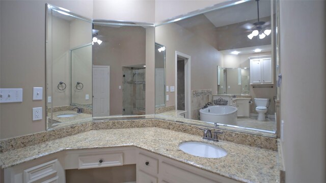 26 Royal Dalton Cir, Conroe, TX 77304 - full bath with toilet, a freestanding bath, a sink, and a stall shower