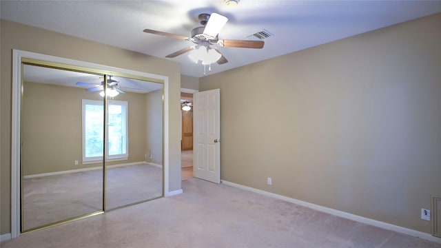 26 Royal Dalton Cir, Conroe, TX 77304 - unfurnished bedroom featuring visible vents, a closet, light carpet, baseboards, and ceiling fan