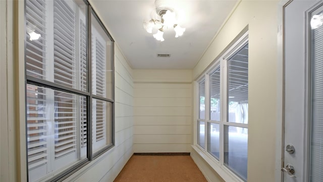 26 Royal Dalton Cir, Conroe, TX 77304 - corridor featuring carpet flooring, visible vents, and an inviting chandelier