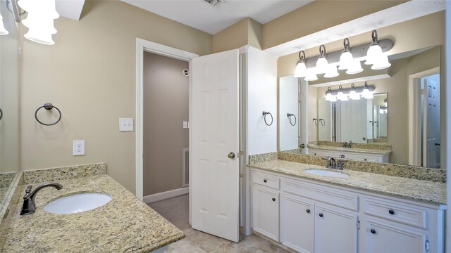26 Royal Dalton Cir, Conroe, TX 77304 - full bathroom with visible vents, a sink, and two vanities