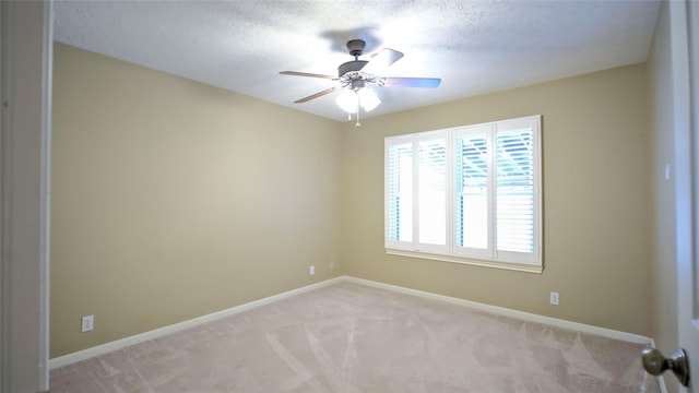 26 Royal Dalton Cir, Conroe, TX 77304 - unfurnished room with light colored carpet, a ceiling fan, and baseboards