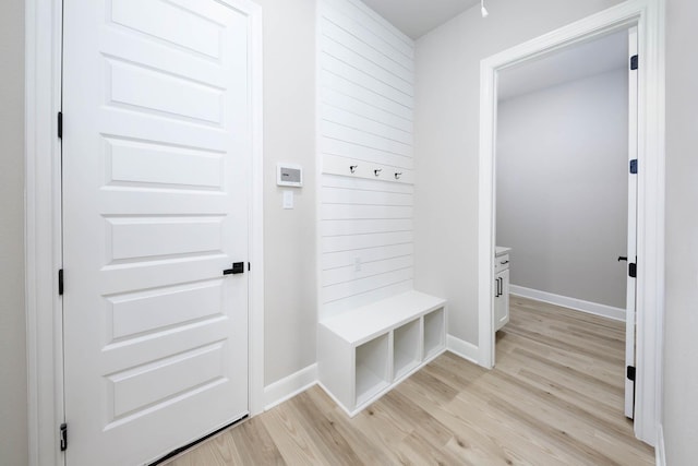 mudroom featuring light wood-type flooring and baseboards