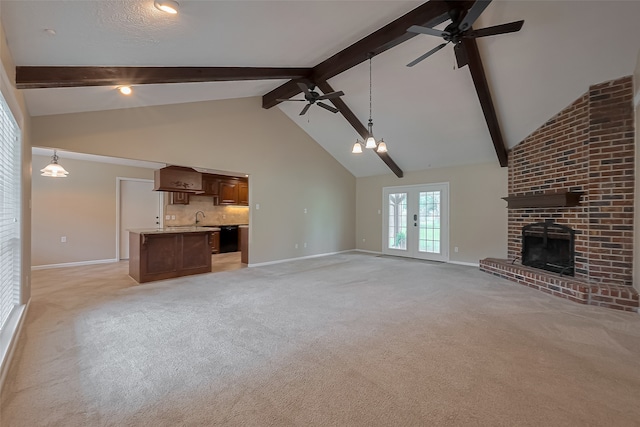 unfurnished living room with a fireplace, high vaulted ceiling, baseboards, and ceiling fan with notable chandelier