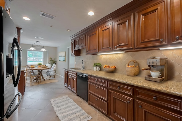 kitchen with dishwasher, visible vents, a sink, tasteful backsplash, and stainless steel refrigerator with ice dispenser